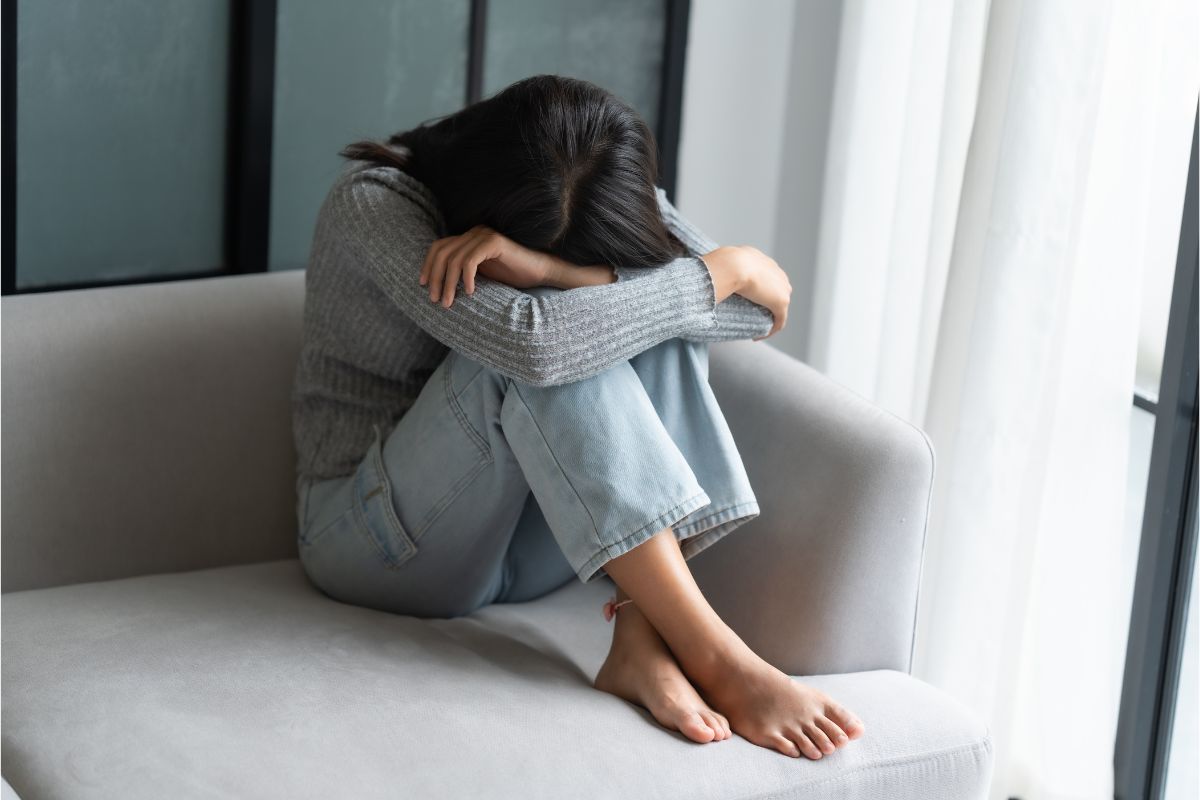 woman alone in front of the beach